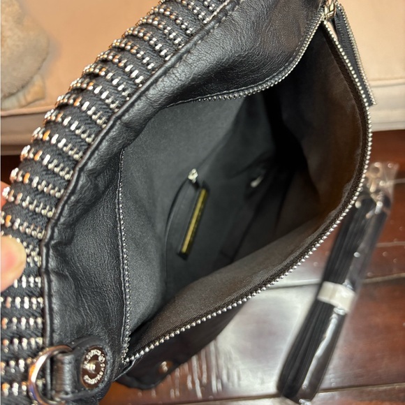 Unique Black Clutch with multi zipper detailing.